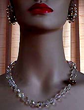 a beautiful vintage costume jewelry necklace, bracelet and earrings