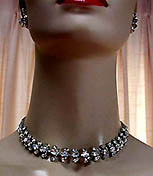 a beautiful vintage costume jewelry necklace, bracelet and earrings