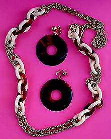 a beautiful vintage costume jewelry necklace, bracelet and earrings