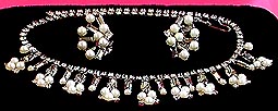 a beautiful vintage costume jewelry necklace, bracelet and earrings