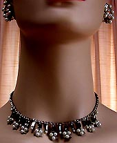 a beautiful vintage costume jewelry necklace, bracelet and earrings