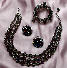 a beautiful vintage costume jewelry necklace, bracelet and earrings