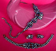 a beautiful vintage costume jewelry necklace, bracelet and earrings