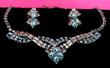 a beautiful vintage costume jewelry necklace, bracelet and earrings