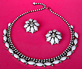 a beautiful vintage costume jewelry necklace, bracelet and earrings