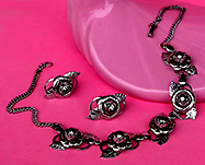 a beautiful vintage costume jewelry necklace, bracelet and earrings