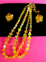 a beautiful vintage costume jewelry necklace, bracelet and earrings