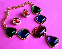 a beautiful vintage costume jewelry necklace, bracelet and earrings