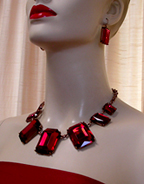 a beautiful vintage costume jewelry necklace, bracelet and earrings