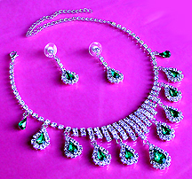 a beautiful vintage costume jewelry necklace, bracelet and earrings