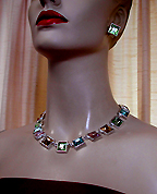 a beautiful vintage costume jewelry necklace, bracelet and earrings