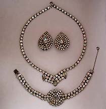 a beautiful vintage costume jewelry necklace, bracelet and clip earrings