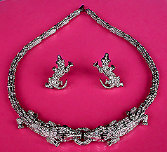 a beautiful vintage costume jewelry necklace, bracelet and earrings