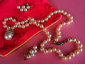 a beautiful vintage costume jewelry necklace, bracelet and earrings