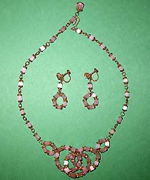 a beautiful vintage costume jewelry necklace, bracelet and clip earrings