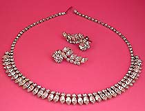 a beautiful vintage costume jewelry necklace and clip earrings