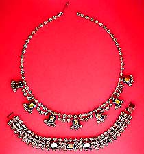 a beautiful vintage costume jewelry necklace, bracelet and clip earrings