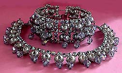 a beautiful vintage costume jewelry necklace, bracelet and earrings