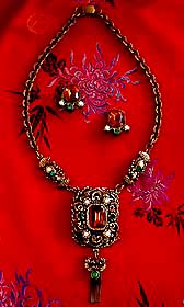 a beautiful vintage costume jewelry necklace, bracelet and earrings