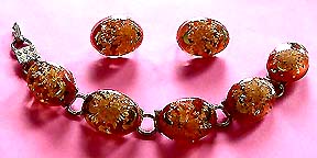 a beautiful vintage costume jewelry necklace, bracelet and earrings