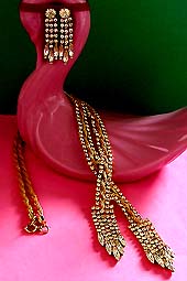 a beautiful vintage costume jewelry necklace, bracelet and earrings