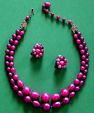 a beautiful vintage costume jewelry brooch and earrings