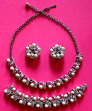 a beautiful vintage costume jewelry necklace, bracelet and earrings