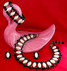 a beautiful vintage costume jewelry brooch and earrings